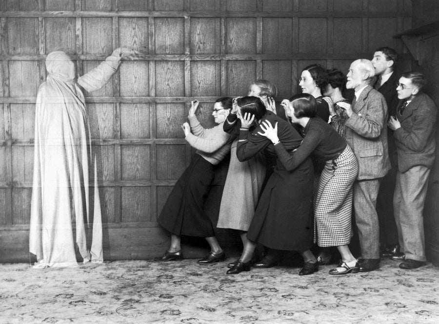 People 'cowering in fear' at the sight of a ghost, c 1920s. Art Print - Science Museum Shop
