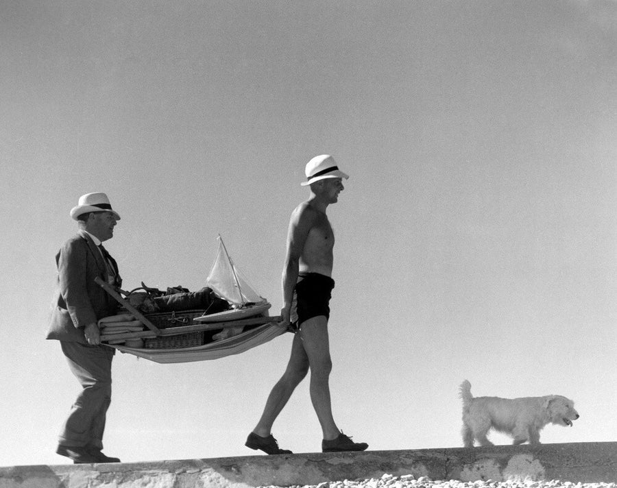 Two men carrying a deckchair, 1920s. Art Print - Science Museum Shop