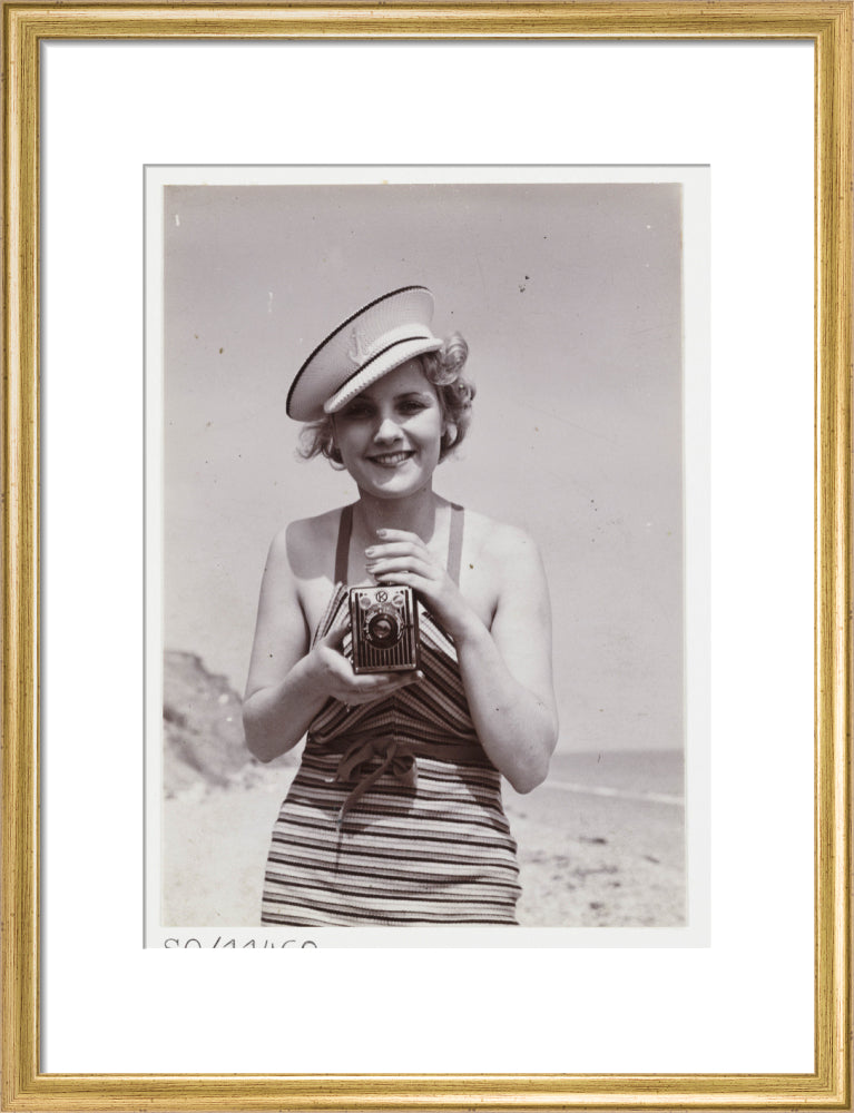 Woman taking a photograph, about 1935 art print medium gold Art Print - Science Museum Shop