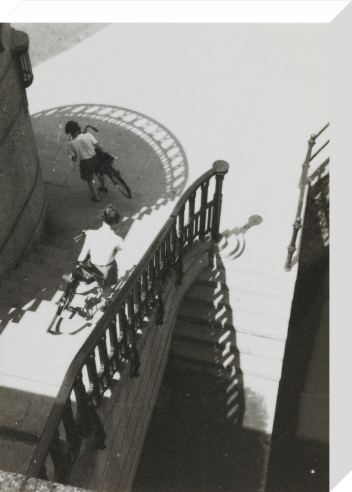 Carrying bicycles down steps stretched canvas medium none Art Print - Science Museum Shop