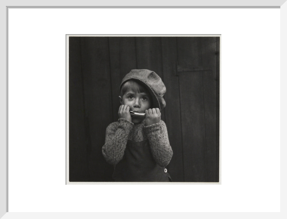 Boy playing the harmonica, about 1925 art print medium white Art Print - Science Museum Shop