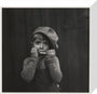 Boy playing the harmonica, about 1925 stretched canvas small none Art Print - Science Museum Shop