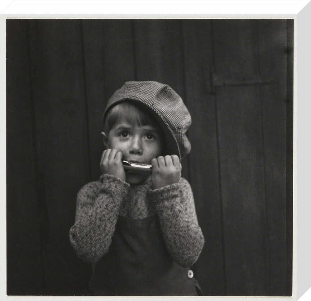Boy playing the harmonica, about 1925 stretched canvas medium none Art Print - Science Museum Shop