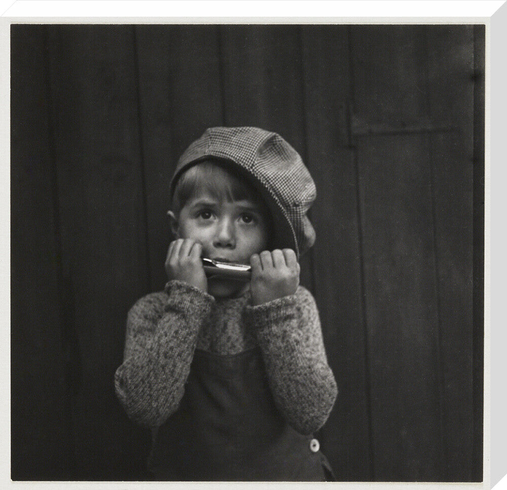 Boy playing the harmonica, about 1925 stretched canvas large none Art Print - Science Museum Shop