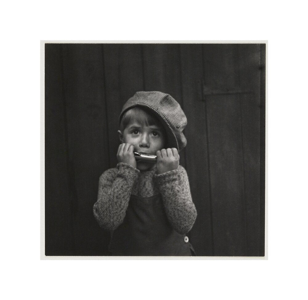 Boy playing the harmonica, about 1925 unstretched canvas small none Art Print - Science Museum Shop