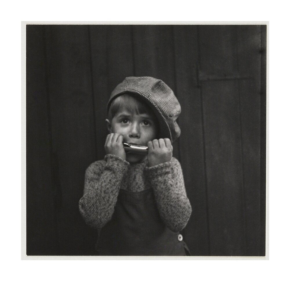 Boy playing the harmonica, about 1925 unstretched canvas large none Art Print - Science Museum Shop