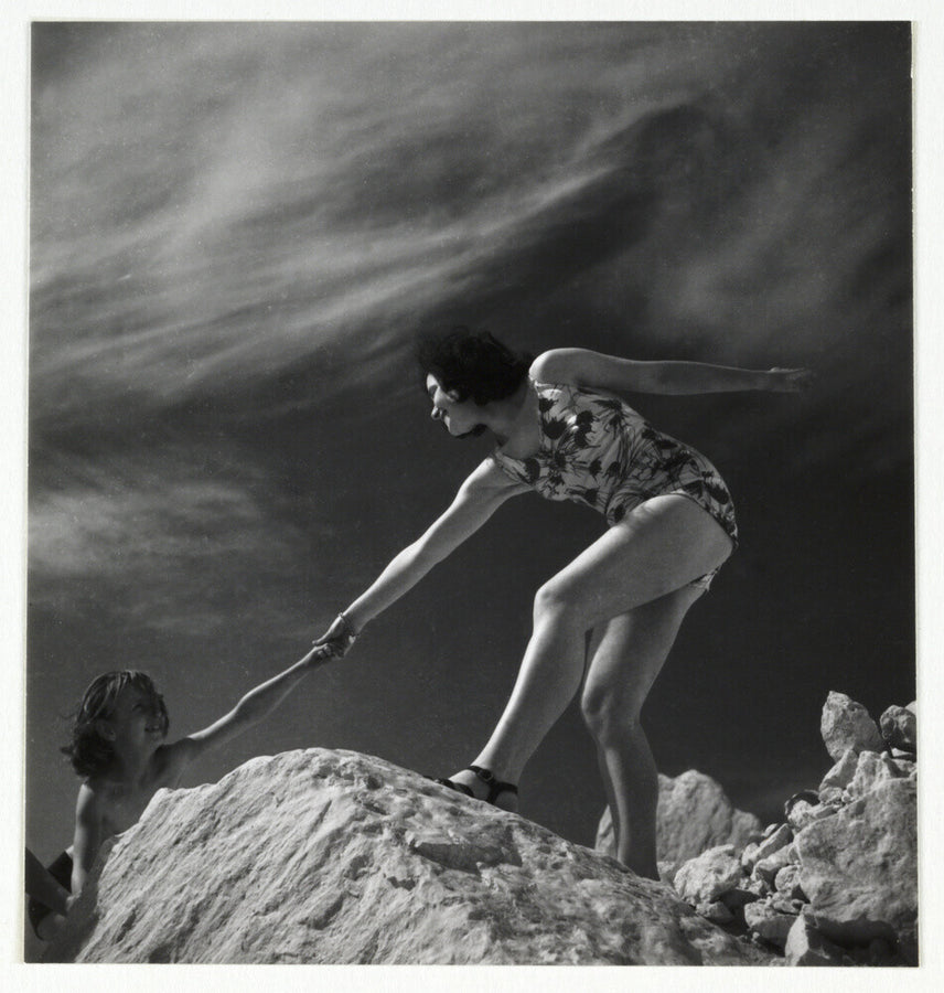 Woman helping child climb onto a rock, about 1935 Art Print - Science Museum Shop