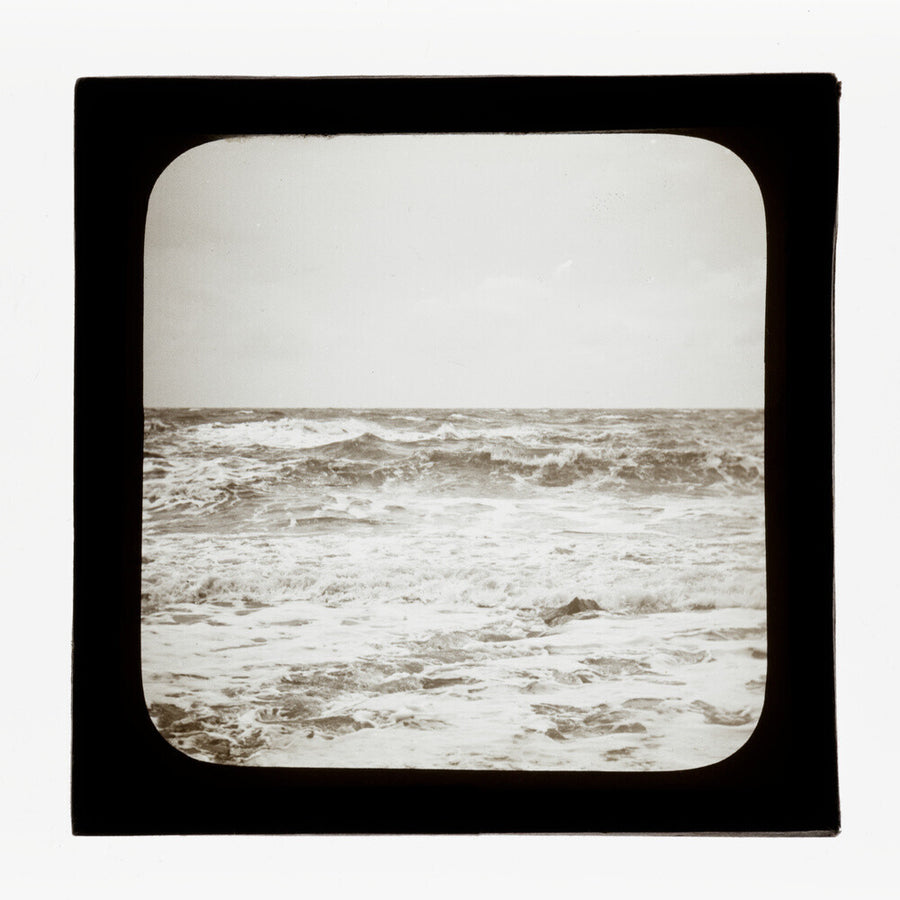 A magic lantern slide of sea waves crashing against the shore by Birt Acres, c. 1893. Art Print - Science Museum Shop
