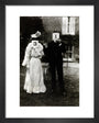 A couple, each holding up a number in front of their face circa 1905 art print extra small black Art Print - Science Museum Shop