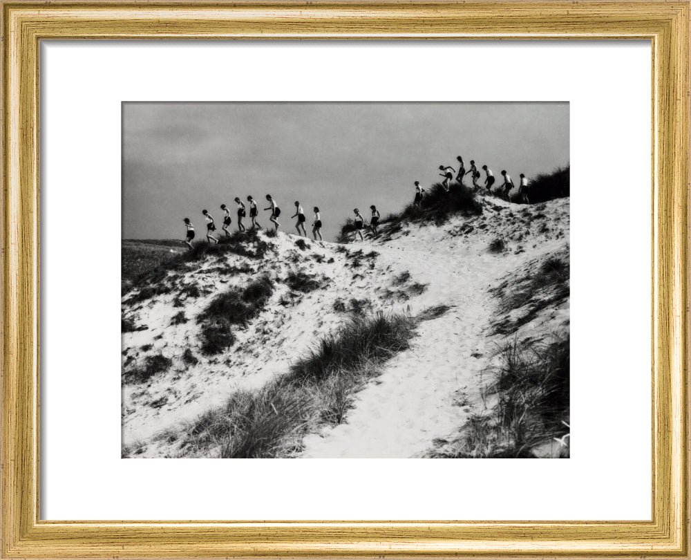 Horizon line of women walking over dunes, about 1930. art print extra small gold Art Print - Science Museum Shop