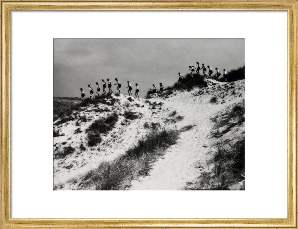 Horizon line of women walking over dunes, about 1930. art print medium gold Art Print - Science Museum Shop