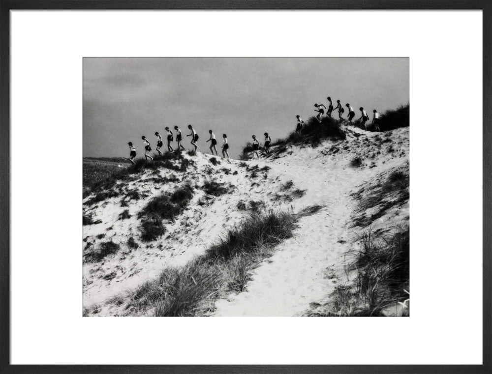 Horizon line of women walking over dunes, about 1930. art print large black Art Print - Science Museum Shop