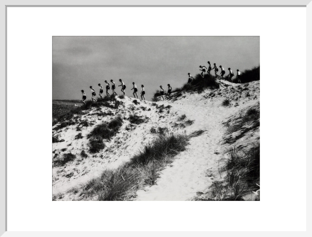 Horizon line of women walking over dunes, about 1930. art print large white Art Print - Science Museum Shop