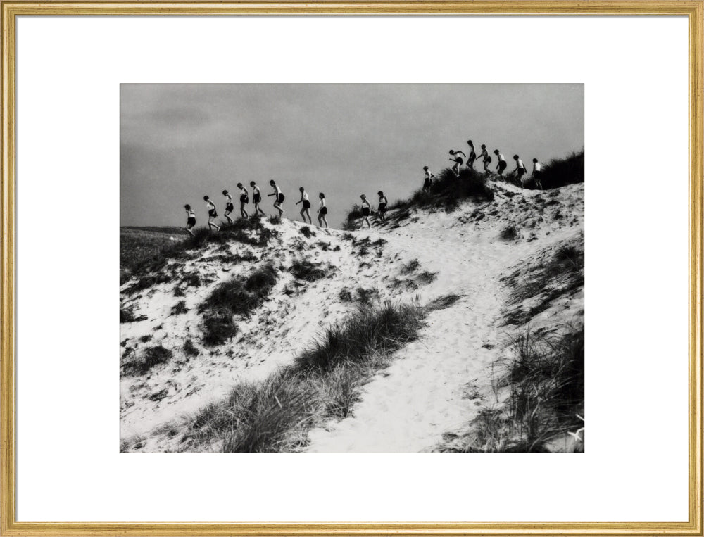 Horizon line of women walking over dunes, about 1930. art print extra large gold Art Print - Science Museum Shop
