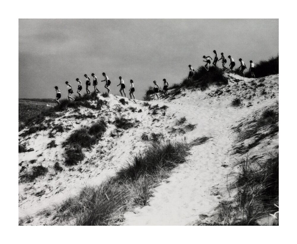 Horizon line of women walking over dunes, about 1930. unstretched canvas extra large none Art Print - Science Museum Shop